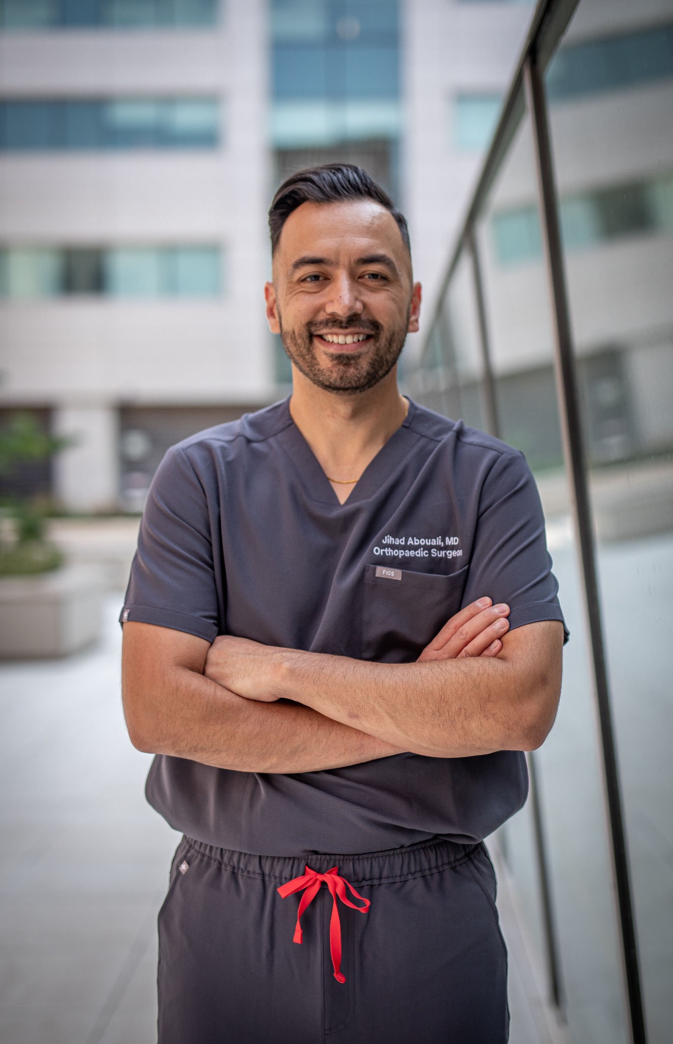 Dr. Jihad Abouali in orthopaedic surgery scrubs